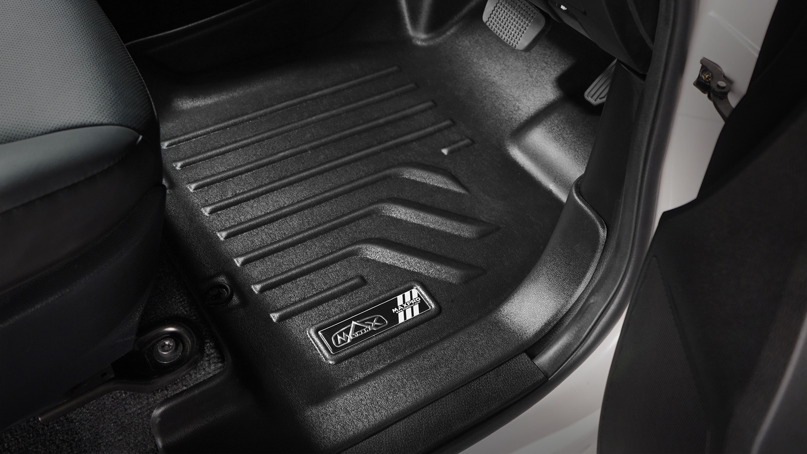 Moulded rubber floor mats fitted in a 4WD footwell
