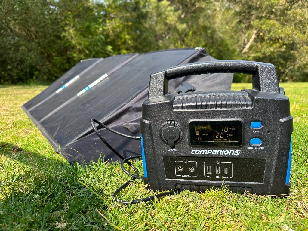 Solar panel and regulator set up at a campsite